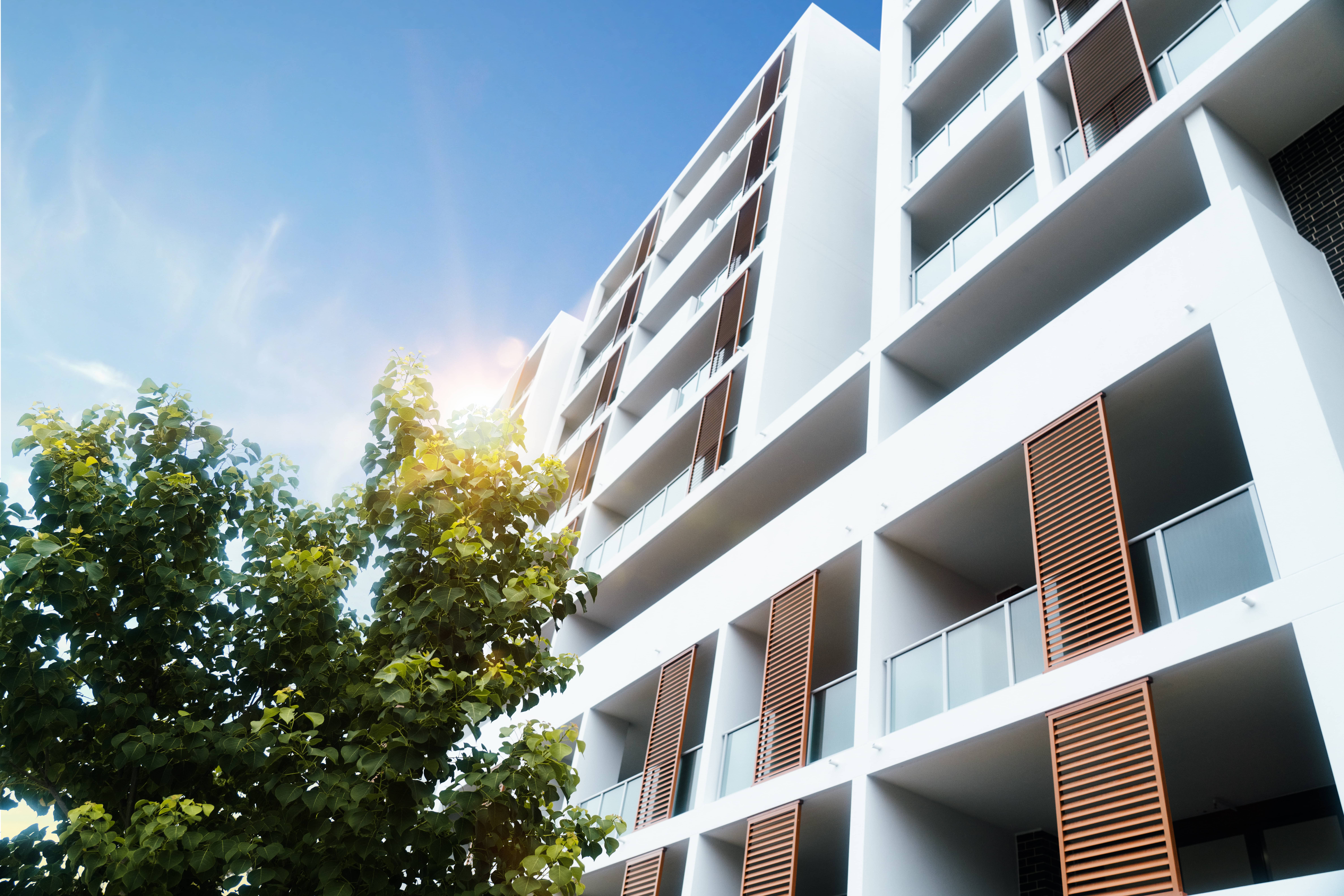 A photograph of a modern apartment exterior