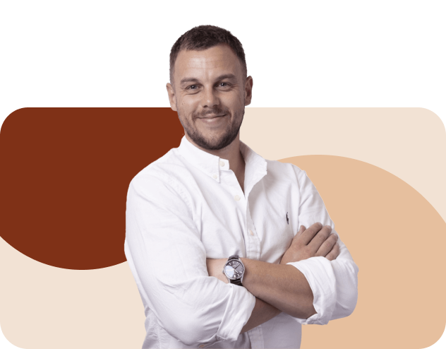 a man in a white shirt with his arms crossed